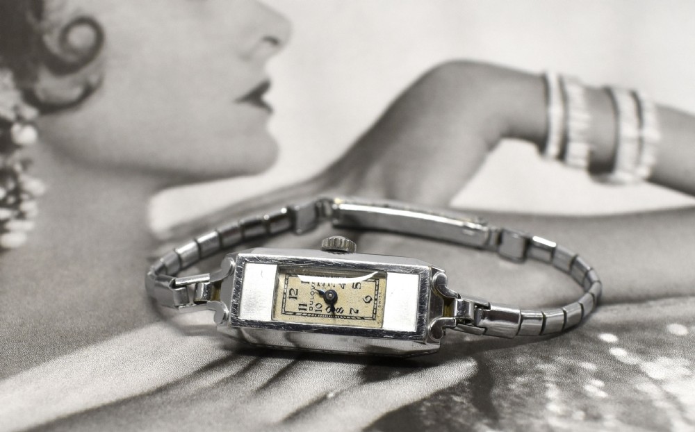 An Art Deco Bulova ladies bracelet watch from 1935 featuring a narrow rectangular silver-coloured case with geometric lugs and an articulated chain strap. View III