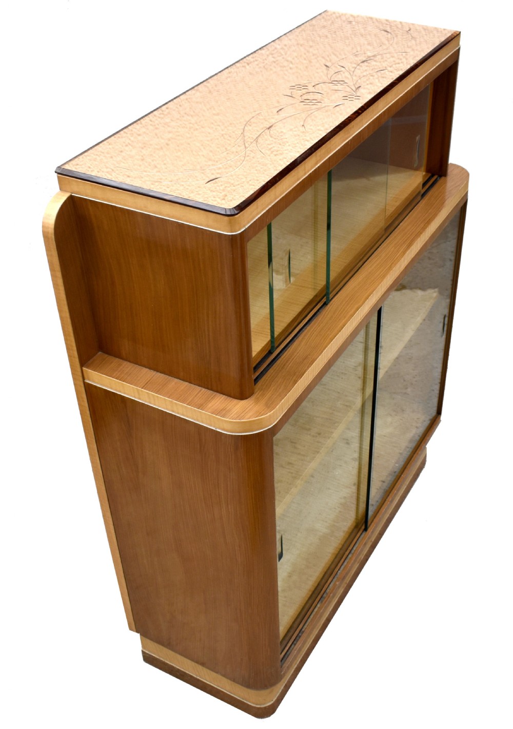 A two-tier Art Deco glazed bookcase constructed from contrasting light sycamore and dark walnut veneers with sliding glass doors. View II