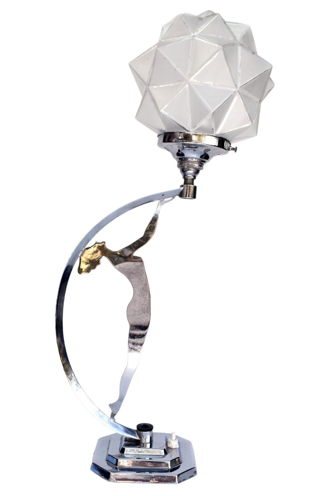 An Art Deco chrome table lamp featuring a stylised female dancer figure holding aloft a frosted geometric glass shade on a stepped base.