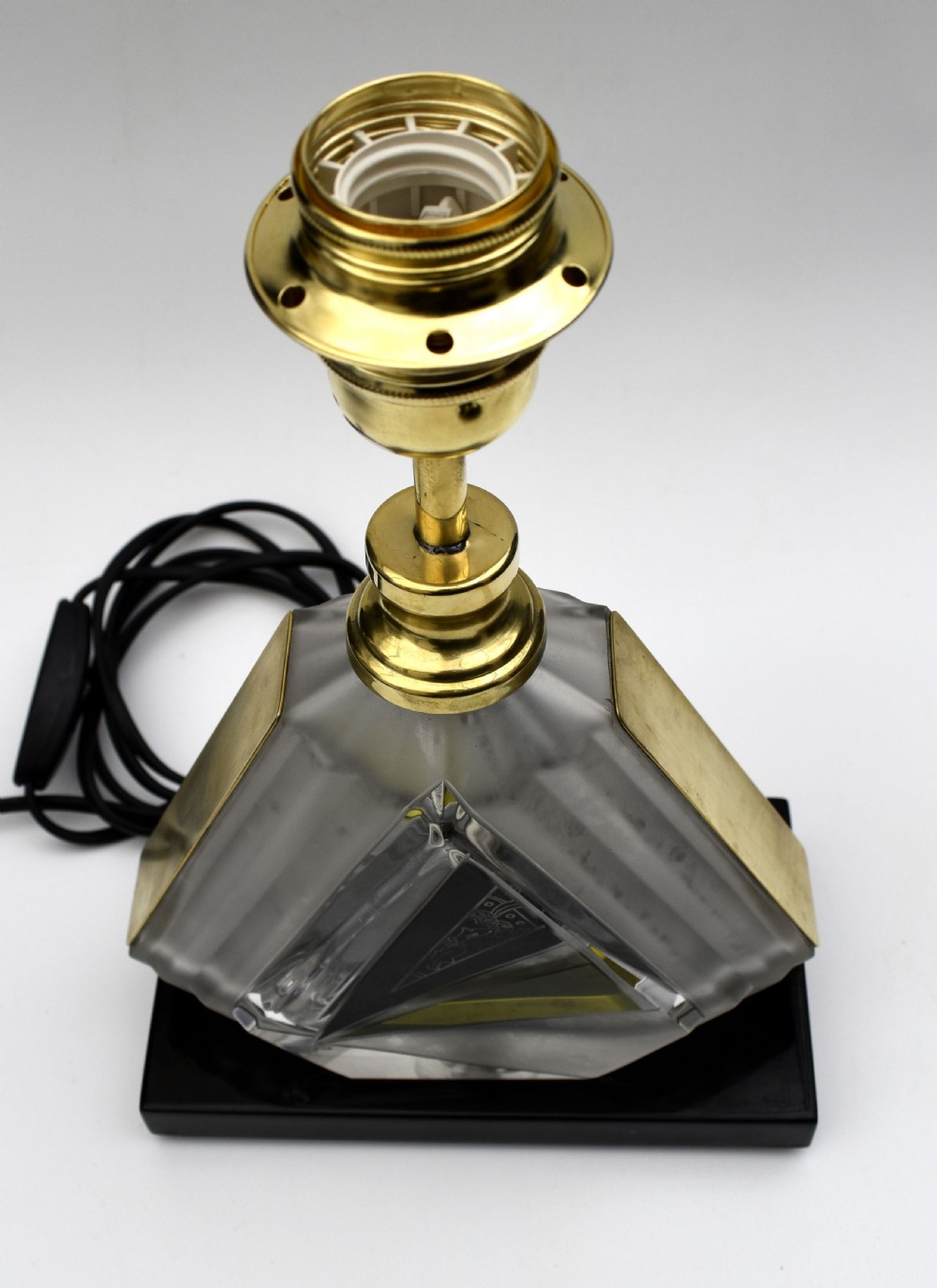 An Art Deco table lamp featuring a geometric cut and enamelled glass base with yellow accents and a printed fan pattern fabric shade. View III
