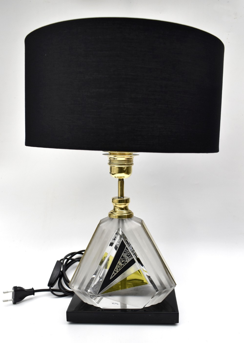 An Art Deco table lamp featuring a geometric cut and enamelled glass base with yellow accents and a printed fan pattern fabric shade. View VI
