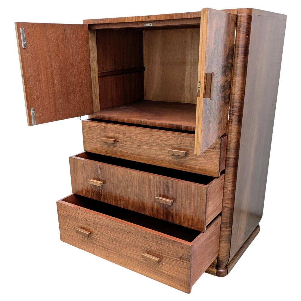 An English Art Deco tallboy crafted from figured burr walnut, featuring a top two-door cupboard above three full-width drawers with matching handles. View XI