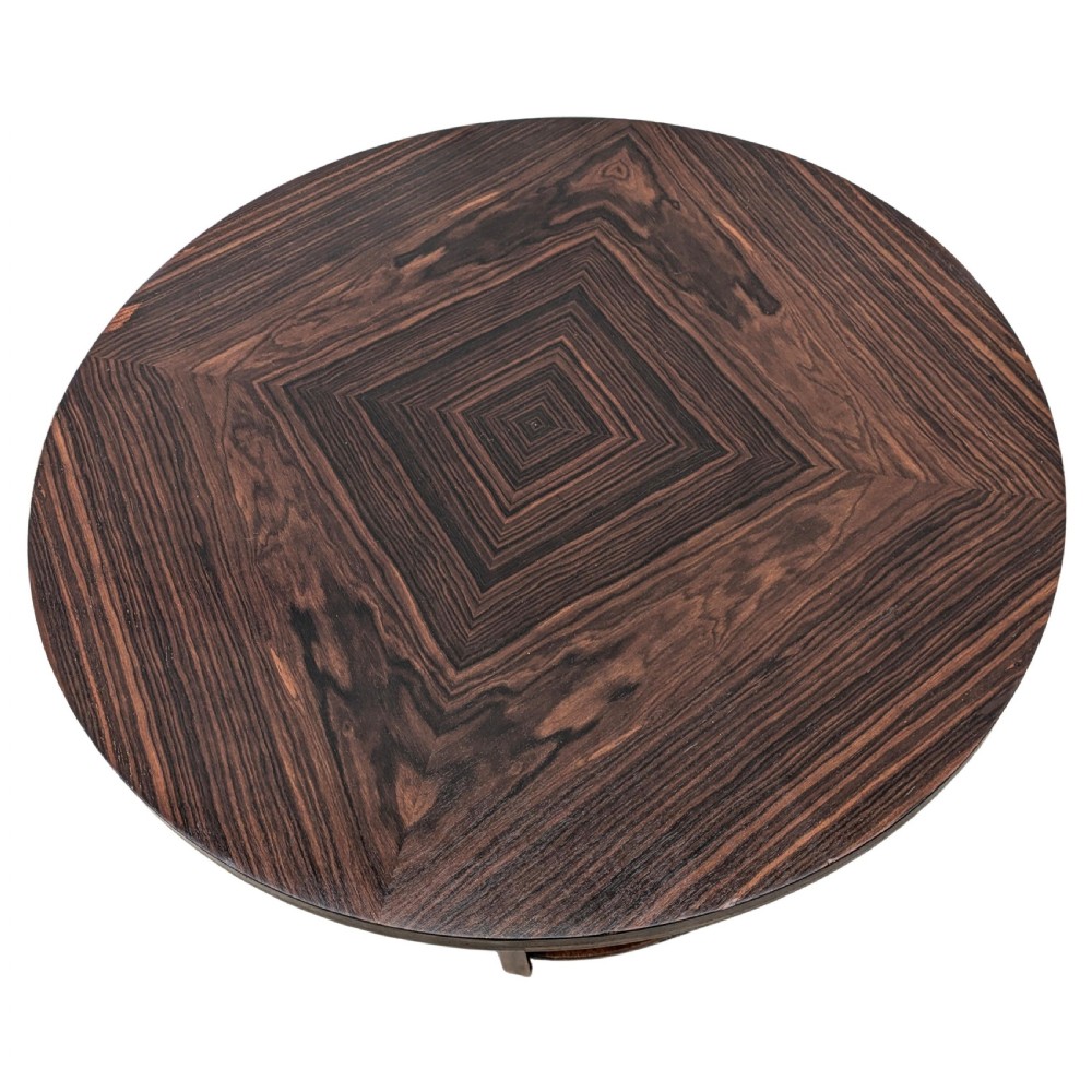 An Art Deco circular dark wood centre table featuring three tiered shelves supported by four vertical legs resting on a solid round base. View VI