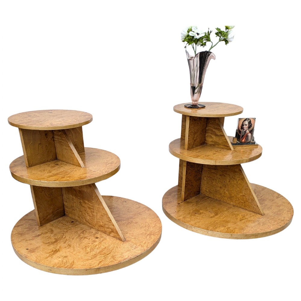 A matching pair of British Art Deco three-tiered modernist occasional tables featuring figured light brown wood veneer and architectural angular supports. View XI