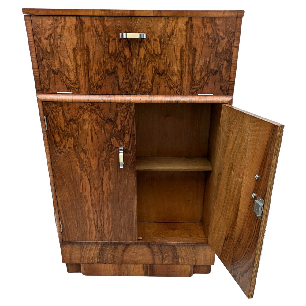 An Art Deco walnut cocktail cabinet featuring an upper pop-up section with integrated bar accessories and a mirrored drop-front serving shelf above double cupboard doors. View VIII