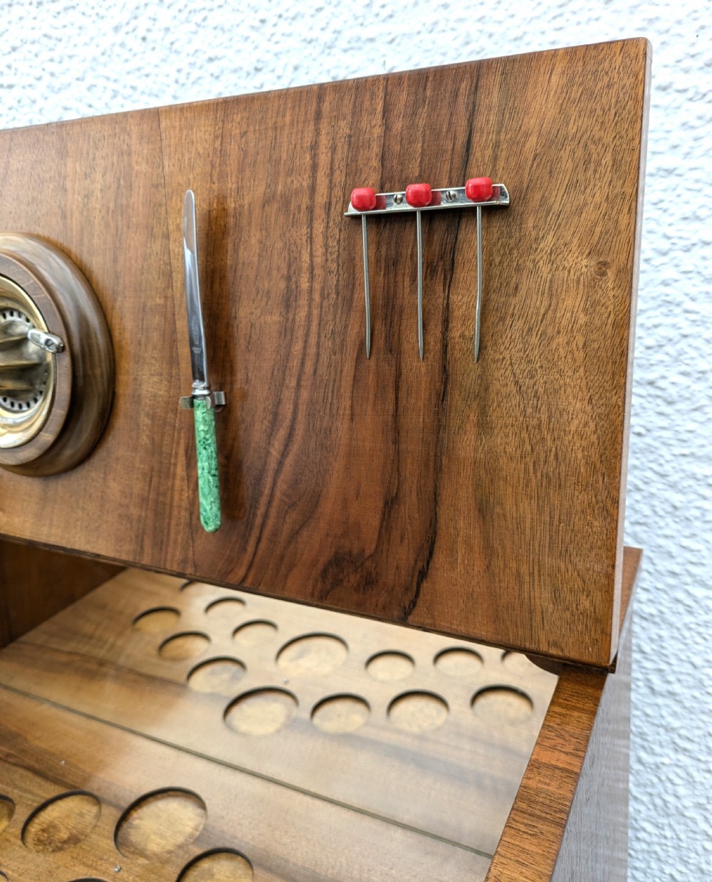 An Art Deco walnut cocktail cabinet featuring an upper pop-up section with integrated bar accessories and a mirrored drop-front serving shelf above double cupboard doors. View XII