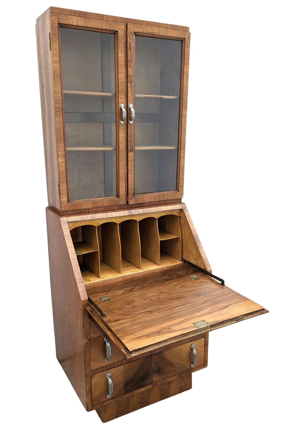 An Art Deco walnut upright bureau bookcase featuring a two-door glazed upper display cabinet above a slope-front writing slope and three drawers. View IX