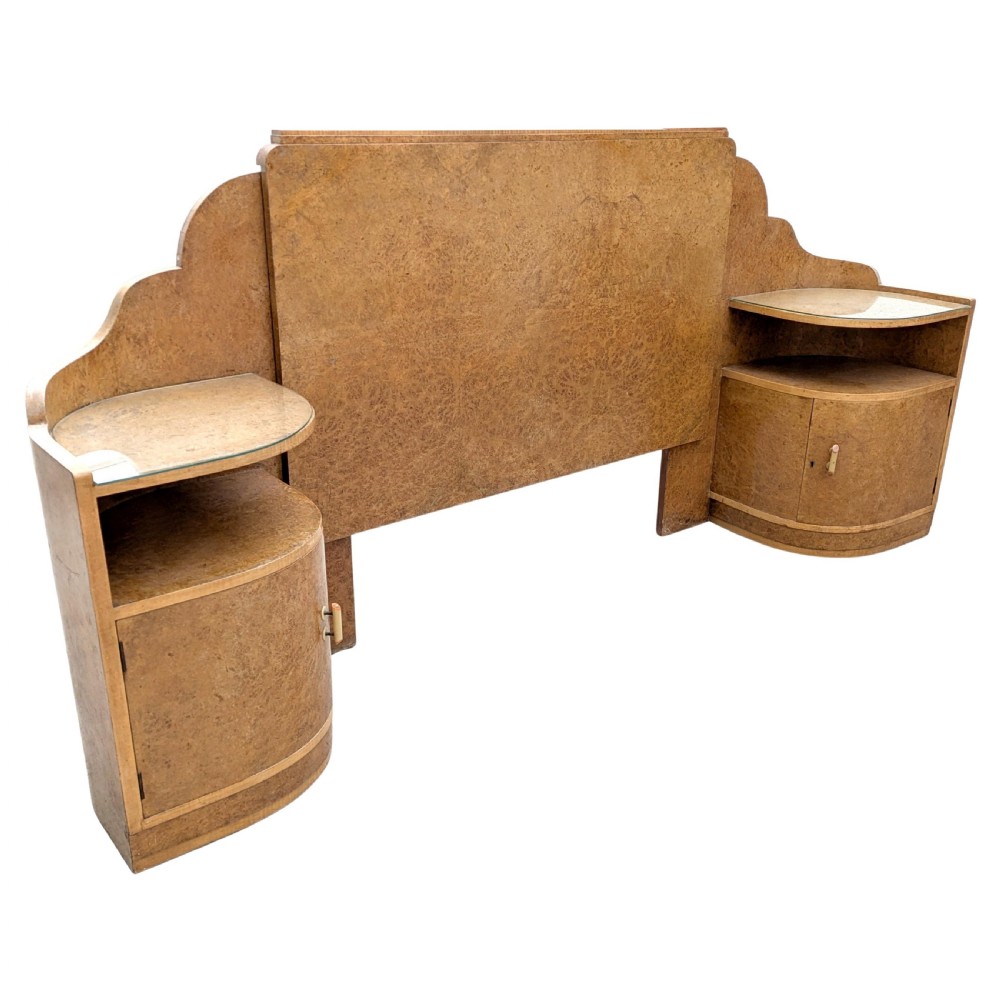 An Art Deco blonde maple headboard featuring a stepped Odeon design with integrated curved bedside cabinets on either side. View IV