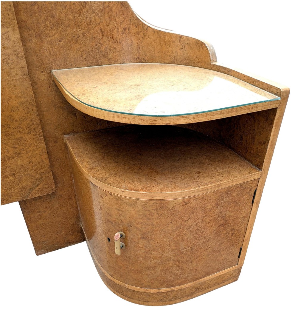 An Art Deco blonde maple headboard featuring a stepped Odeon design with integrated curved bedside cabinets on either side. View V
