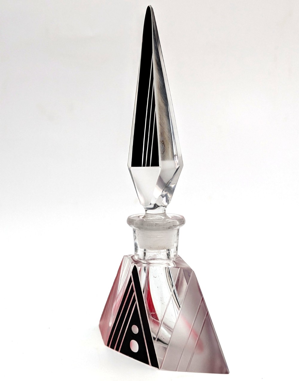 An Art Deco clear and frosted glass perfume bottle featuring a tall faceted stopper and black enamelled geometric designs. View II