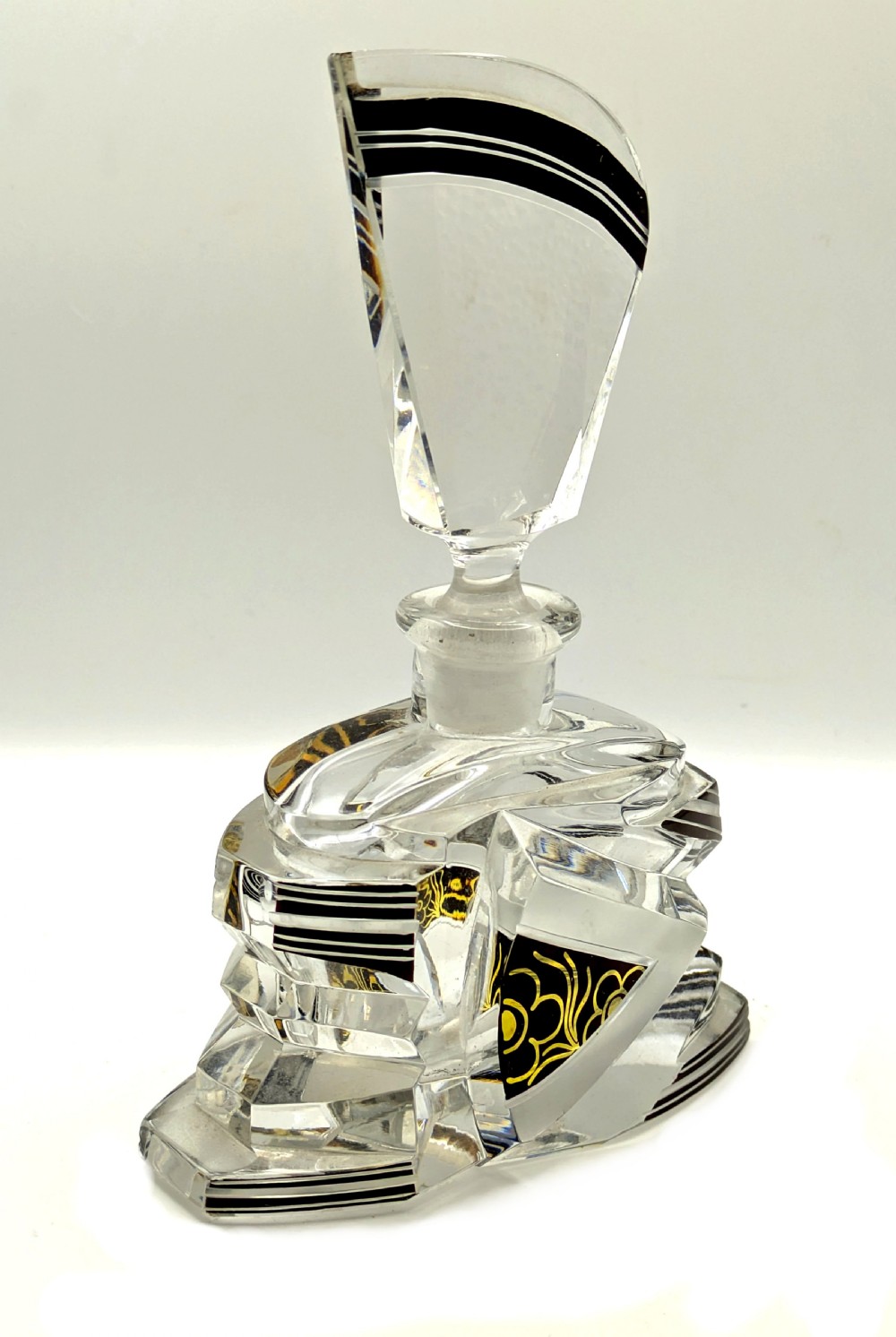 Geometric Art Deco clear glass perfume bottle with black enamel stripes, gold detailing, and a fan-shaped glass stopper. View II