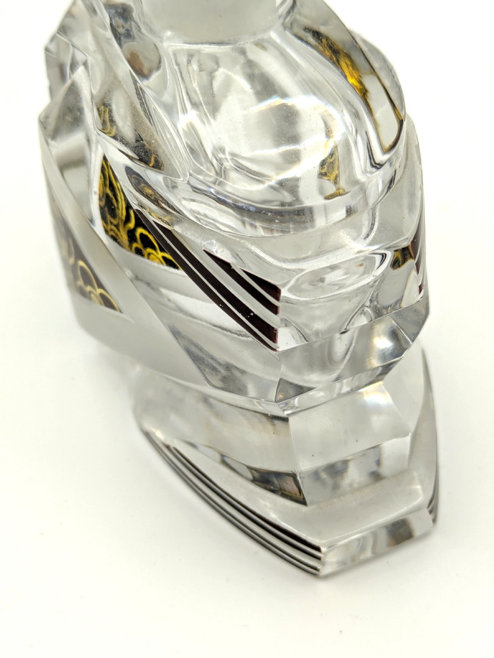 Geometric Art Deco clear glass perfume bottle with black enamel stripes, gold detailing, and a fan-shaped glass stopper. View VI