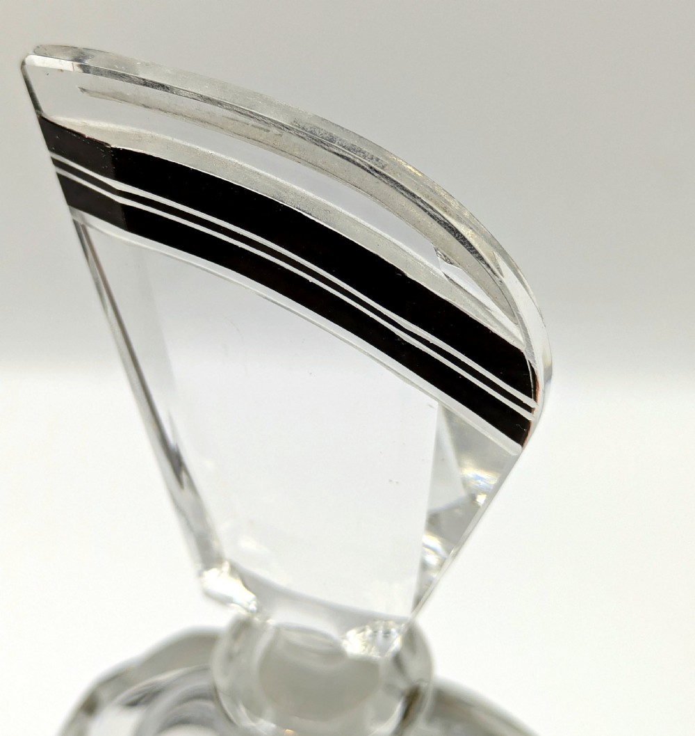 Geometric Art Deco clear glass perfume bottle with black enamel stripes, gold detailing, and a fan-shaped glass stopper. View VIII