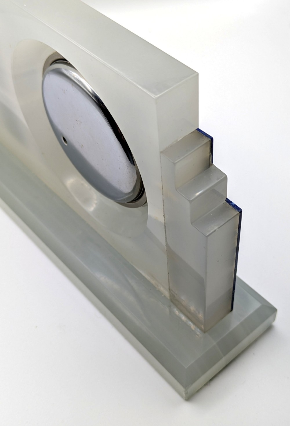 An Art Deco cream onyx desk weather station featuring a square barometer dial, central thermometer, and square clock face flanked by stepped blue lapis lazuli accents. View V
