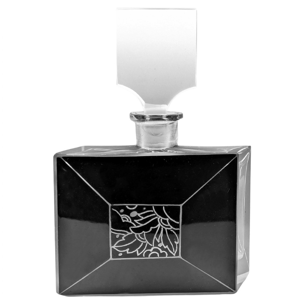 An Art Deco rectangular clear glass perfume bottle featuring black enamelled geometric borders, a central etched floral motif, and a tall rectangular glass stopper.