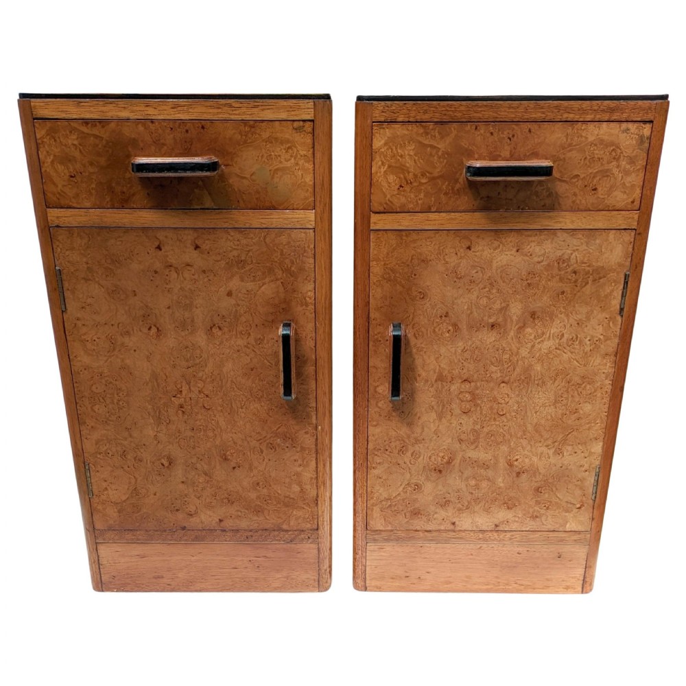 A pair of Art Deco blonde maple bedside cabinets, each featuring a single top drawer and a lower cupboard door with dark wooden handles. View IV