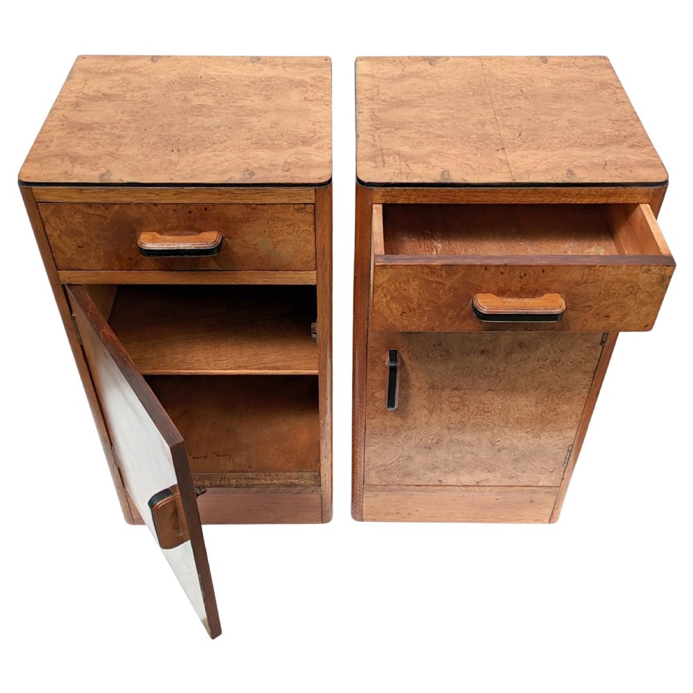 A pair of Art Deco blonde maple bedside cabinets, each featuring a single top drawer and a lower cupboard door with dark wooden handles. View VI