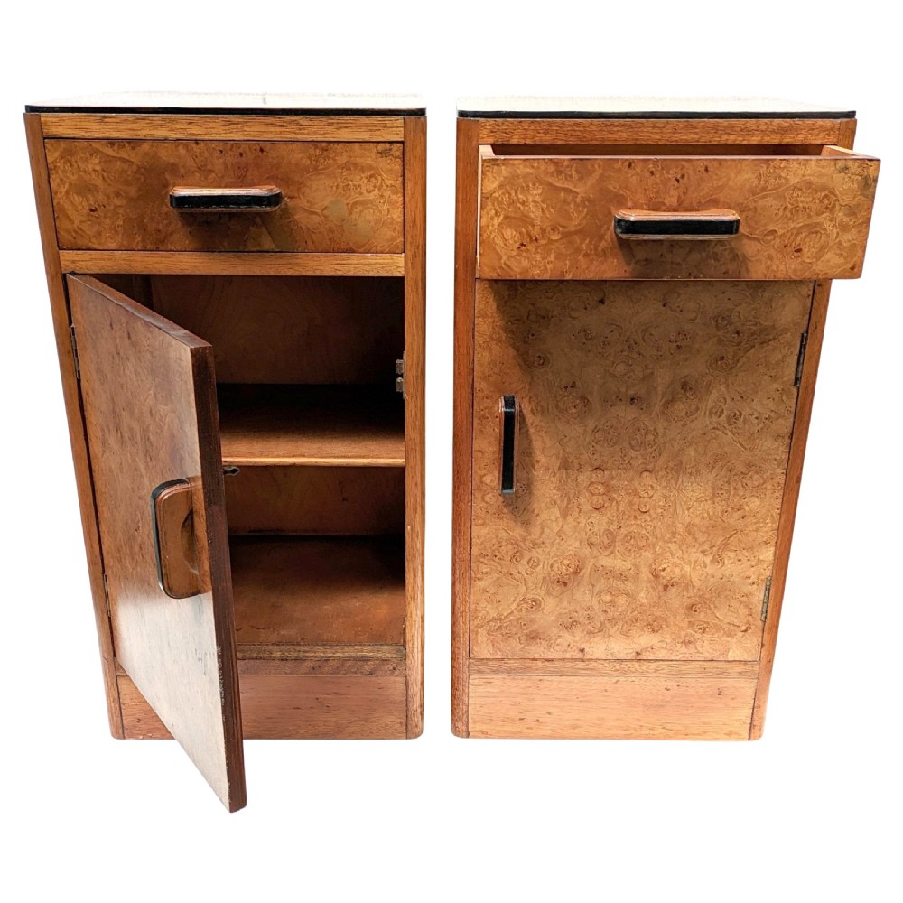 A pair of Art Deco blonde maple bedside cabinets, each featuring a single top drawer and a lower cupboard door with dark wooden handles. View VII