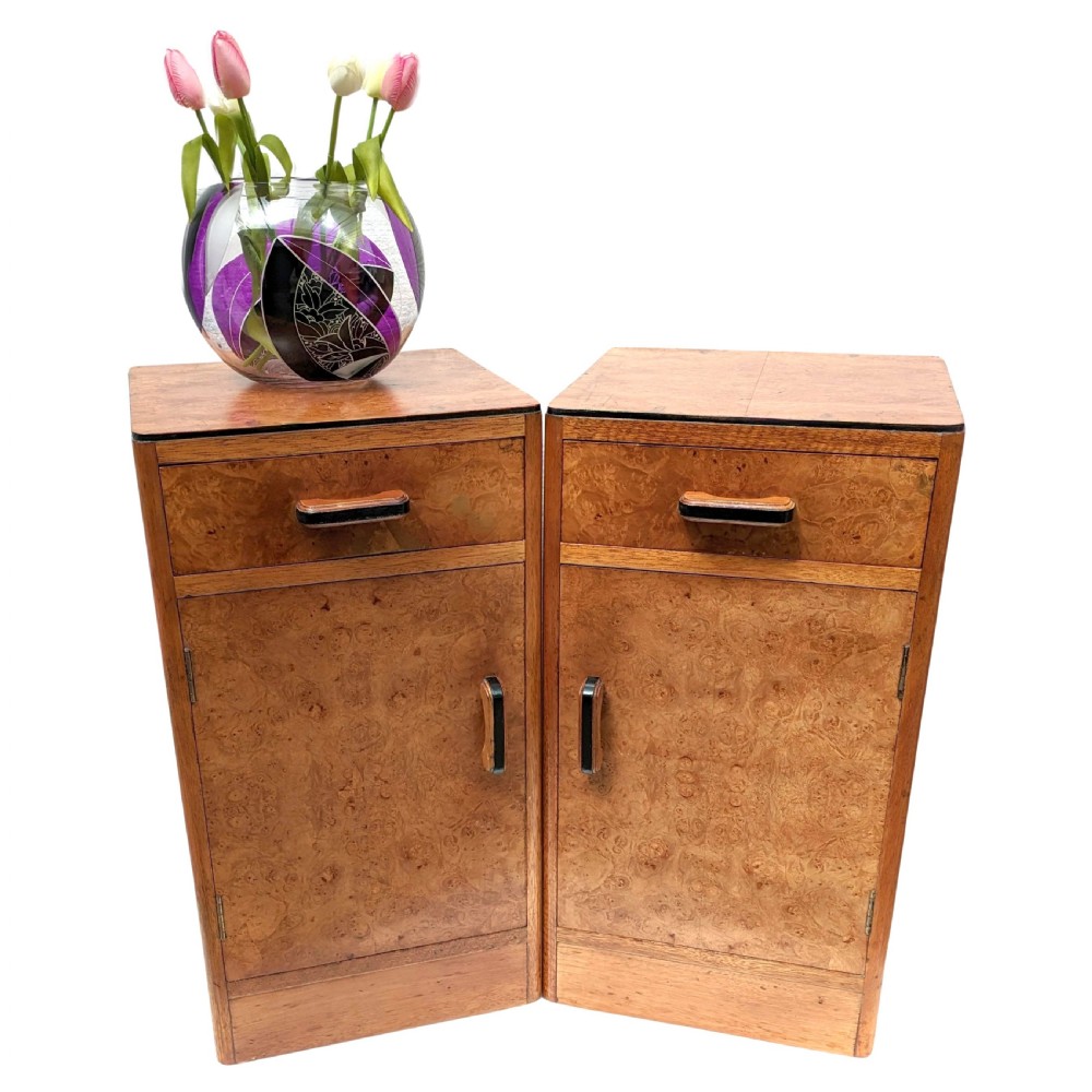 A pair of Art Deco blonde maple bedside cabinets, each featuring a single top drawer and a lower cupboard door with dark wooden handles. View VIII