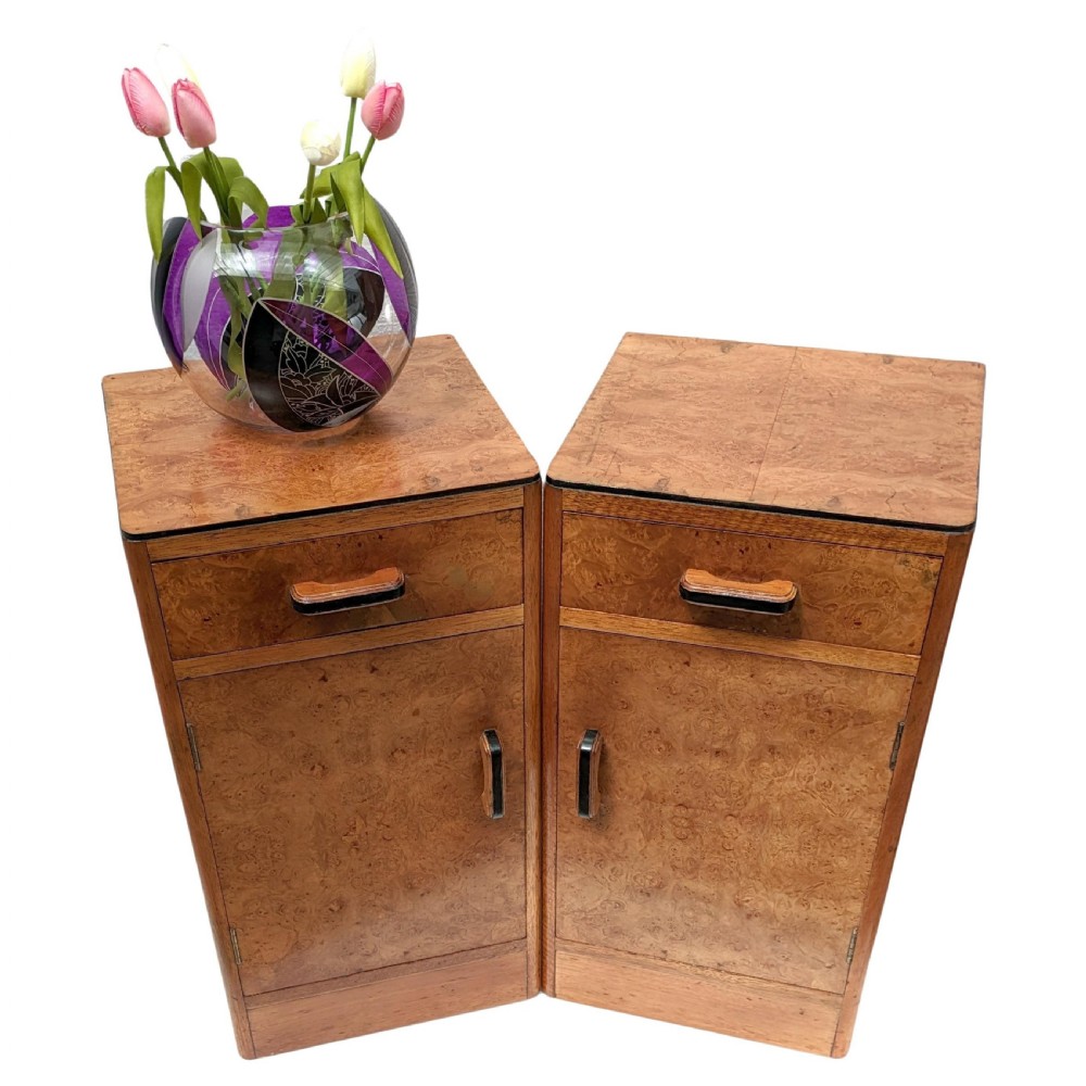A pair of Art Deco blonde maple bedside cabinets, each featuring a single top drawer and a lower cupboard door with dark wooden handles. View IX