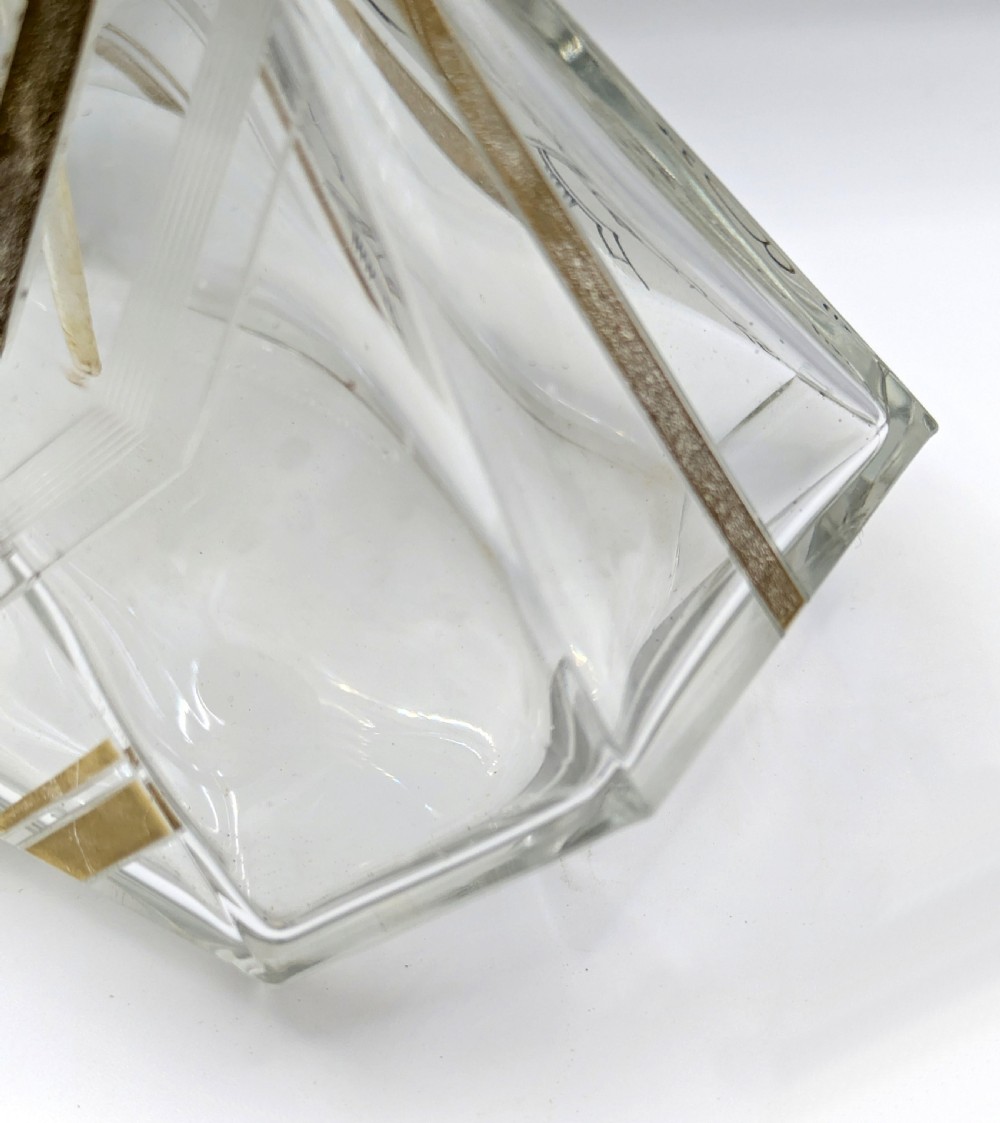 A geometric Art Deco clear glass perfume atomiser bottle with gold and black enamelled patterns, featuring a brass mount and black woven squeeze bulb with tassel. View VII