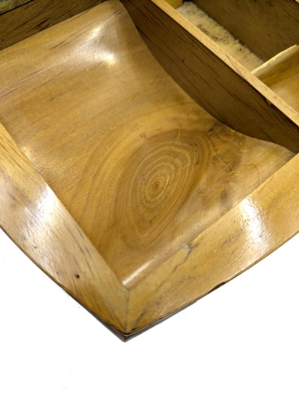 An Art Deco burr walnut cigarette box with a brass front latch and an inlaid metal Scottie dog motif on the lid. View VI