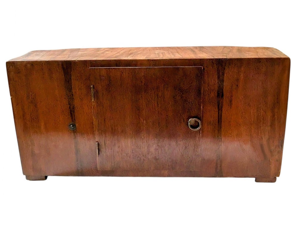 An Art Deco horizontal mantel clock crafted from figured walnut veneer featuring a square glass dial set within a polished chrome frame. View VIII