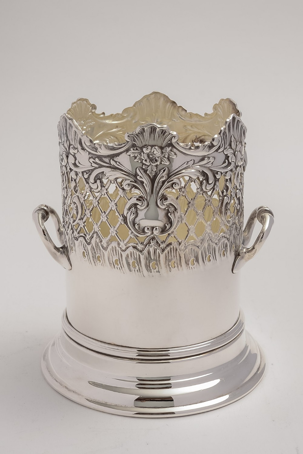 Edwardian Pierced and Embossed silver plated bottle holder