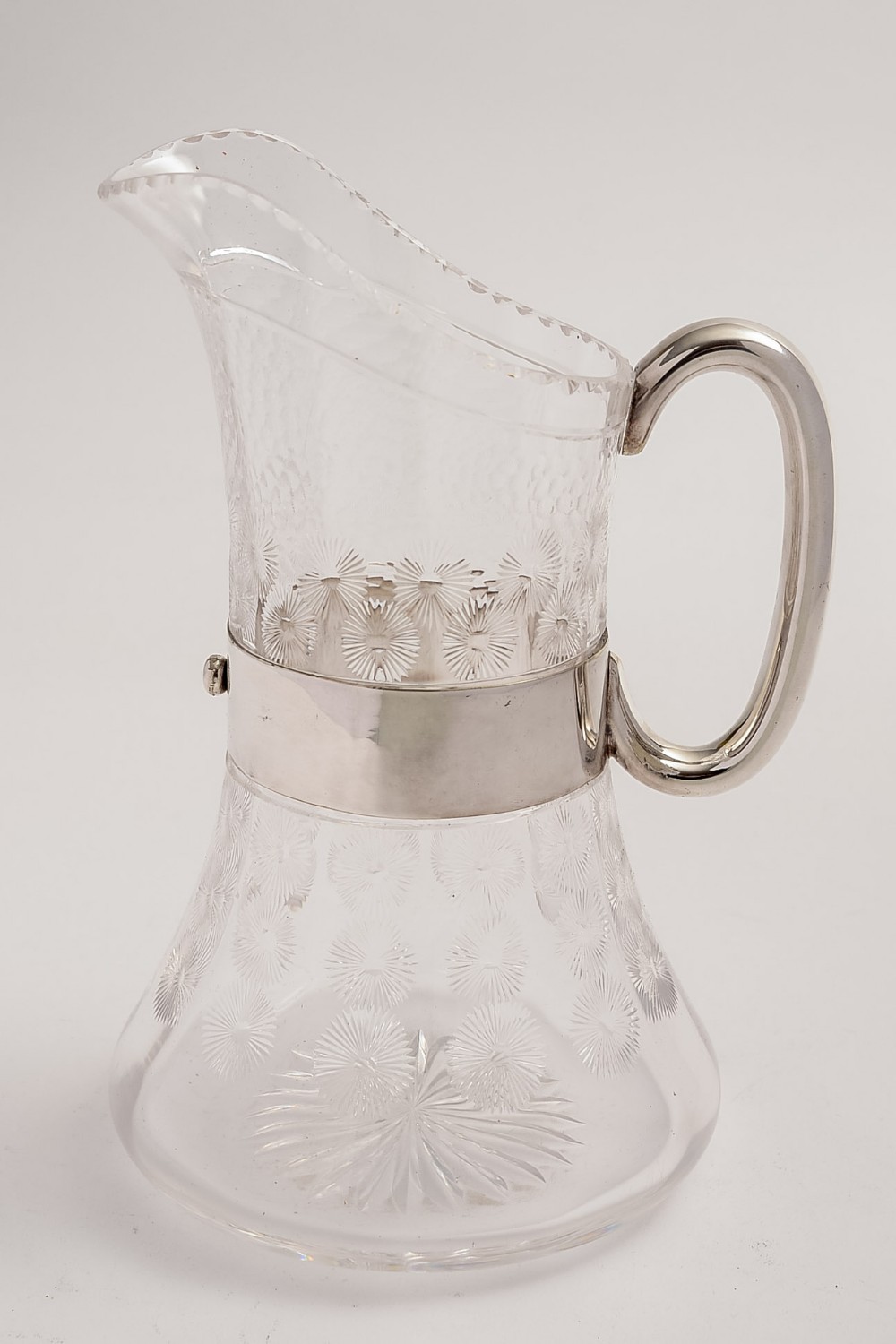 Arts and Crafts 'Christopher Dresser' style silver plated and glass water jug.