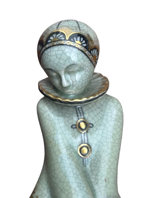 An Art Deco Royal Copenhagen ceramic figurine featuring a crackle pale green glaze with dark blue floral patterns and gilt accents. View II
