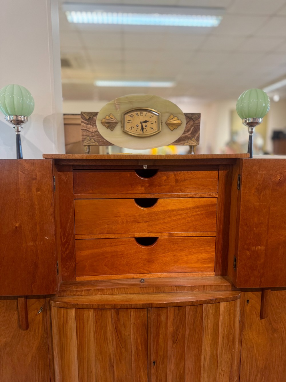 An Art Deco walnut sideboard featuring a stepped silhouette, fluted central cabinet doors, and figured veneer panels. View III