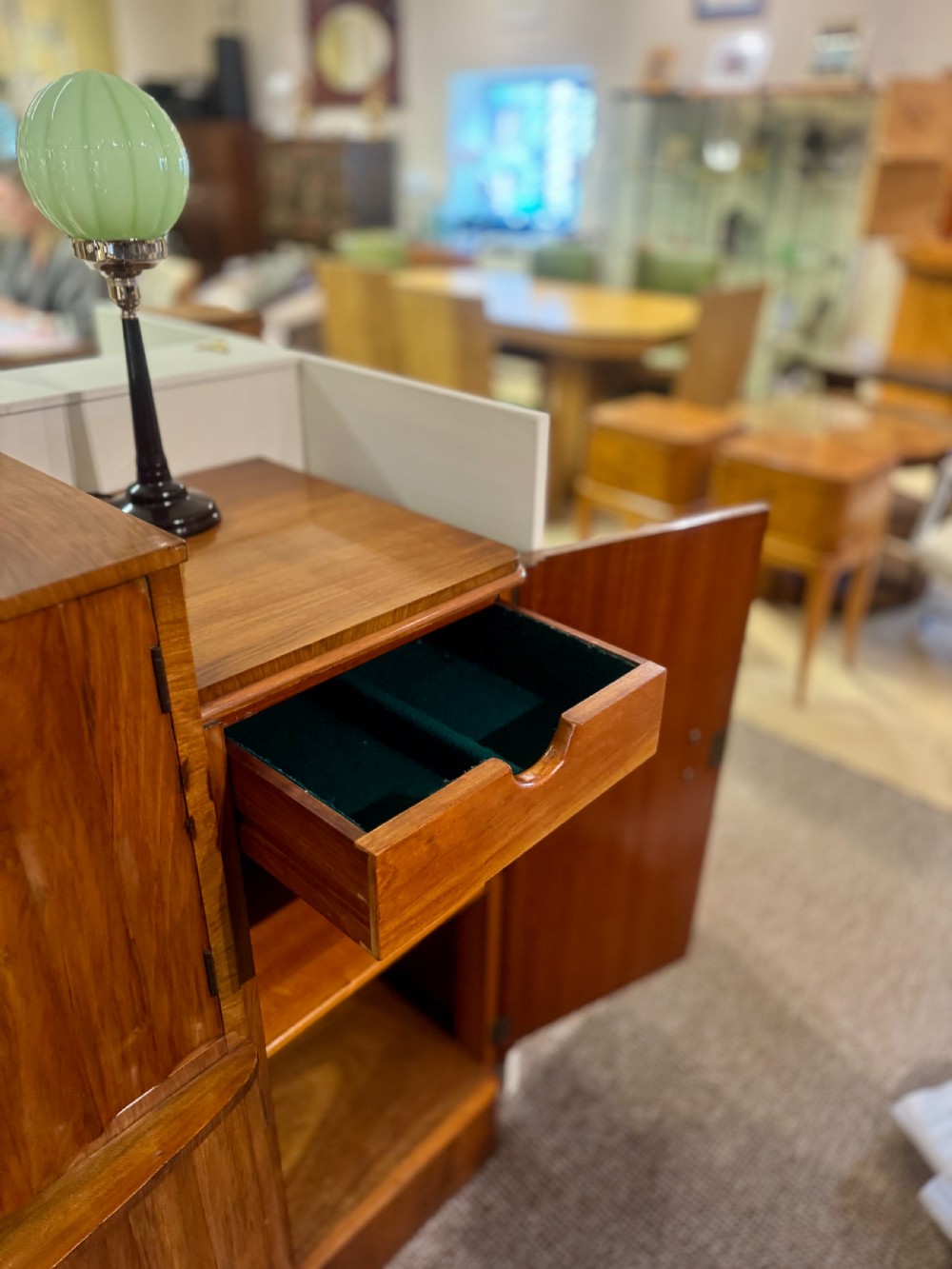 An Art Deco walnut sideboard featuring a stepped silhouette, fluted central cabinet doors, and figured veneer panels. View VI
