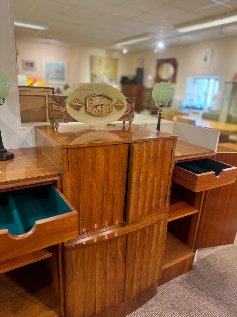 An Art Deco walnut sideboard featuring a stepped silhouette, fluted central cabinet doors, and figured veneer panels. View IX
