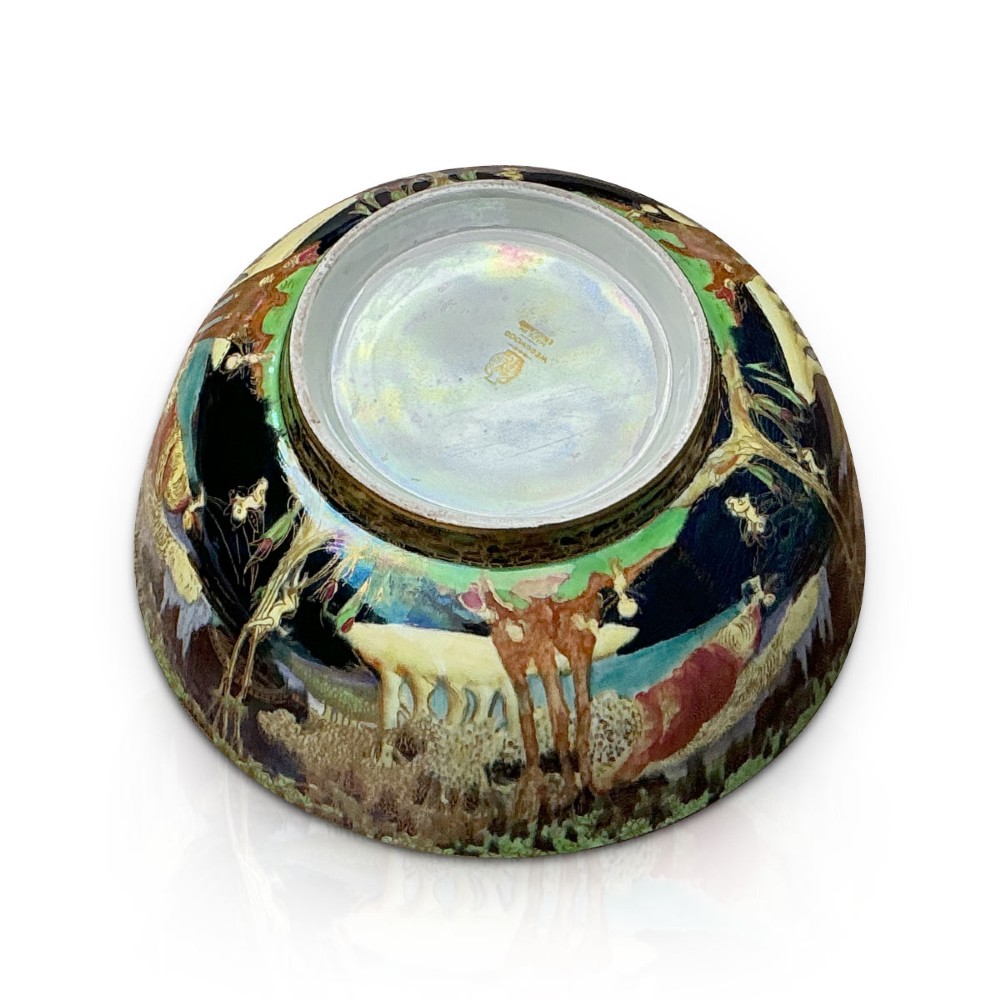 A circular Wedgwood Fairyland Lustre porcelain bowl decorated with vibrant iridescent woodland scenes and fine gold leaf detailing. View IX