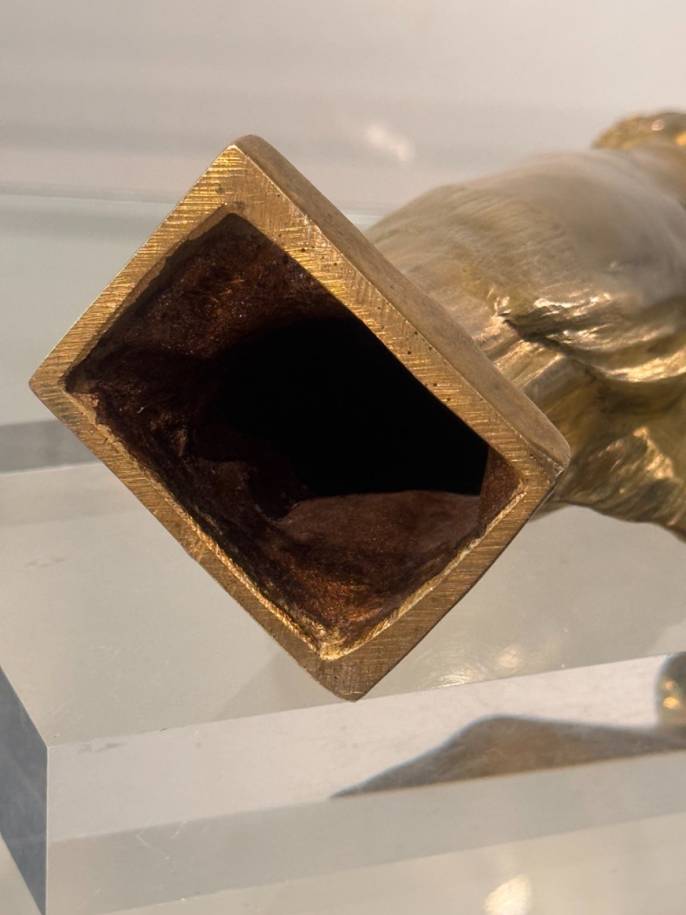 An Art Nouveau gilded bronze sculpture depicting a woman draped in a heavy fringed shawl looking upward, mounted on a square integrated base. View VI