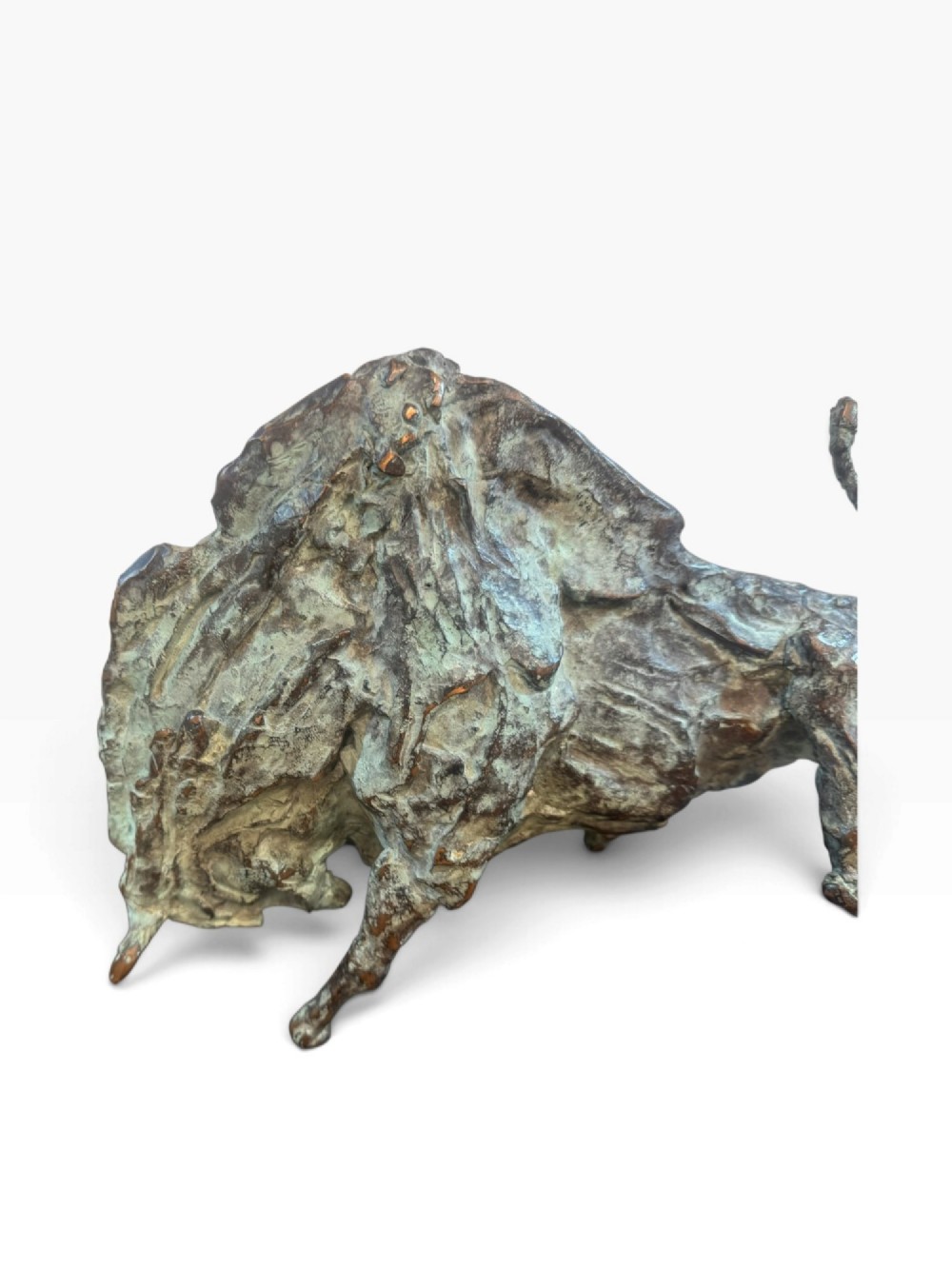 A patinated bronze sculpture depicting a charging bull with a heavily textured surface, mounted on a dark rectangular base. View IV