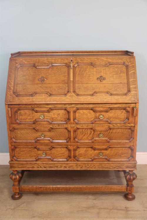 This Fine Jacobean Revival Solid Light Oak Bureau