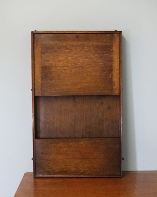 This Early 20th Century Wall Mounted Oak Combination Desk and Letter Rack