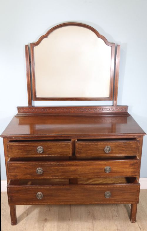 fig 1. Edwardian mahogany and line inlaid dressing chest.