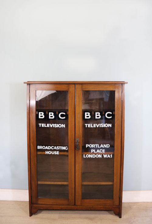 A Mid-century Glazed Two Door Bookcase Cabinet.