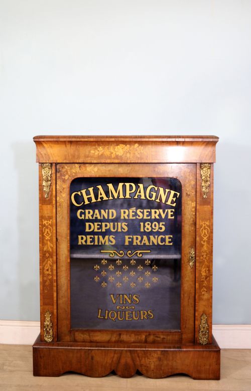 A Lovely Victorian Walnut and Floral Inlaid Pier Cabinet, Later Sign Written in French with Champagne Advertising.