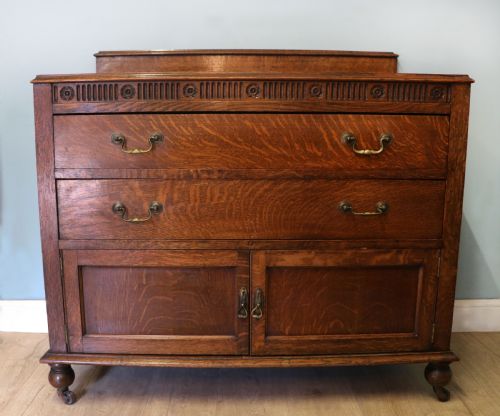 A Edwardian Oak Combination Chest and Cupboard.