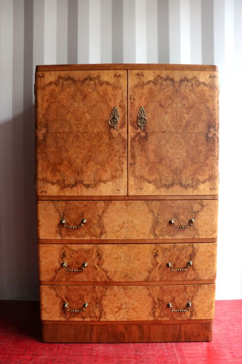 A 1930s Burr Walnut Veneered Tallboy Cabinet.