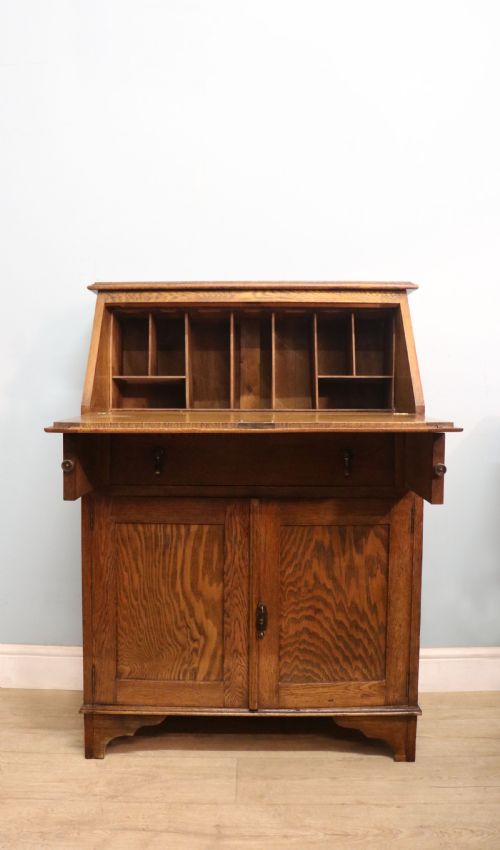A Late Victorian Oak Bureau in the Arts and Crafts Style.