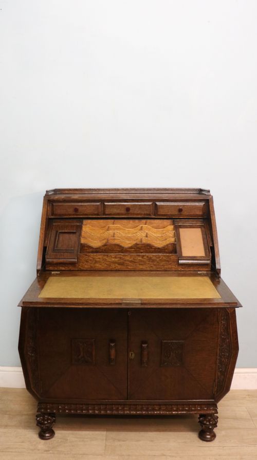 A MOST UNUSUALLY CONFIGURED OAK VENEERED BUREAU - ADDITIONAL PHOTO 1