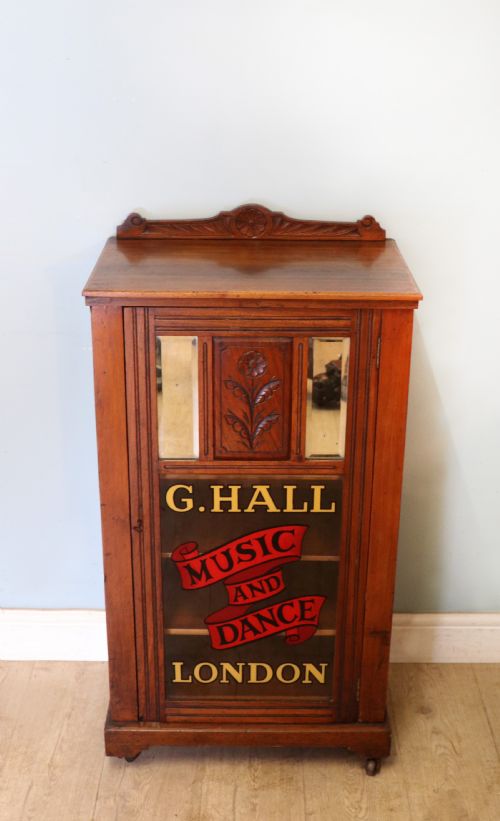 A Late Victorian American Walnut Cabinet, Later Sign Written for G.hall of London.