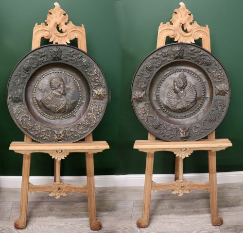 A WONDERFUL PAIR OF COPPER GOTHIC STYLE WALL CHARGERS DECORATED WITH THE PORTRAITS OF HENRY IV AND QUEEN MARIE DE' MDICIS