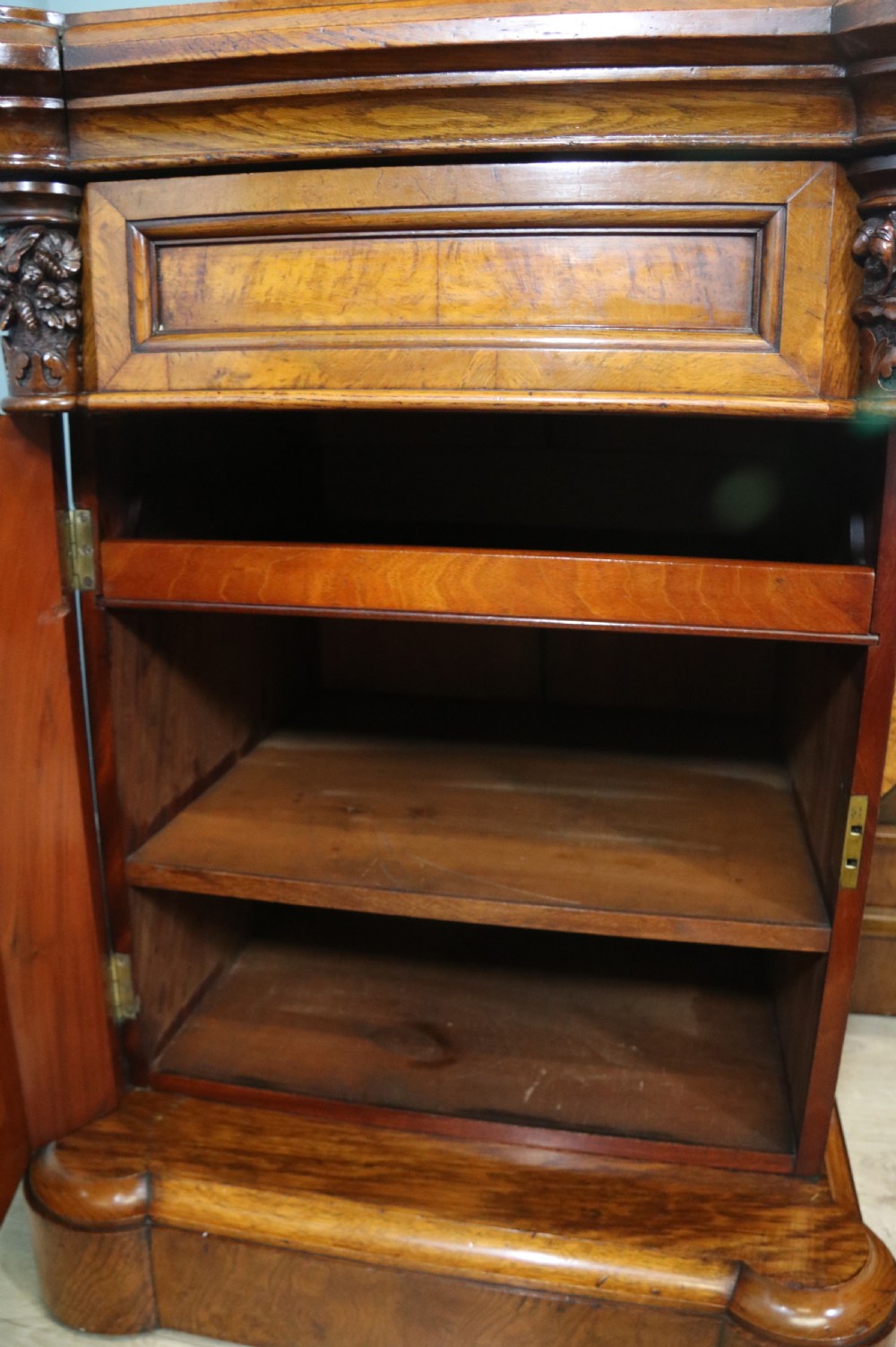 A Victorian Gothic Revival sideboard crafted from pollard oak featuring intricate geometric wood inlays, turned black columns, twin pedestal cupboards, and a tiered upper superstructure. View VI
