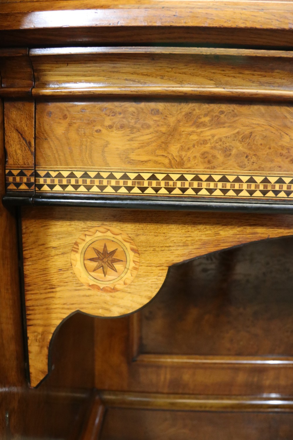 A Victorian Gothic Revival sideboard crafted from pollard oak featuring intricate geometric wood inlays, turned black columns, twin pedestal cupboards, and a tiered upper superstructure. View VIII