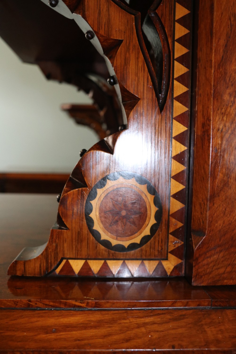 A Victorian Gothic Revival sideboard crafted from pollard oak featuring intricate geometric wood inlays, turned black columns, twin pedestal cupboards, and a tiered upper superstructure. View XIV